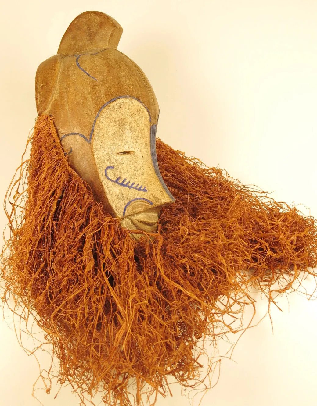 Fang Ngil Mask of Blue Scars and Vibrant Raffia